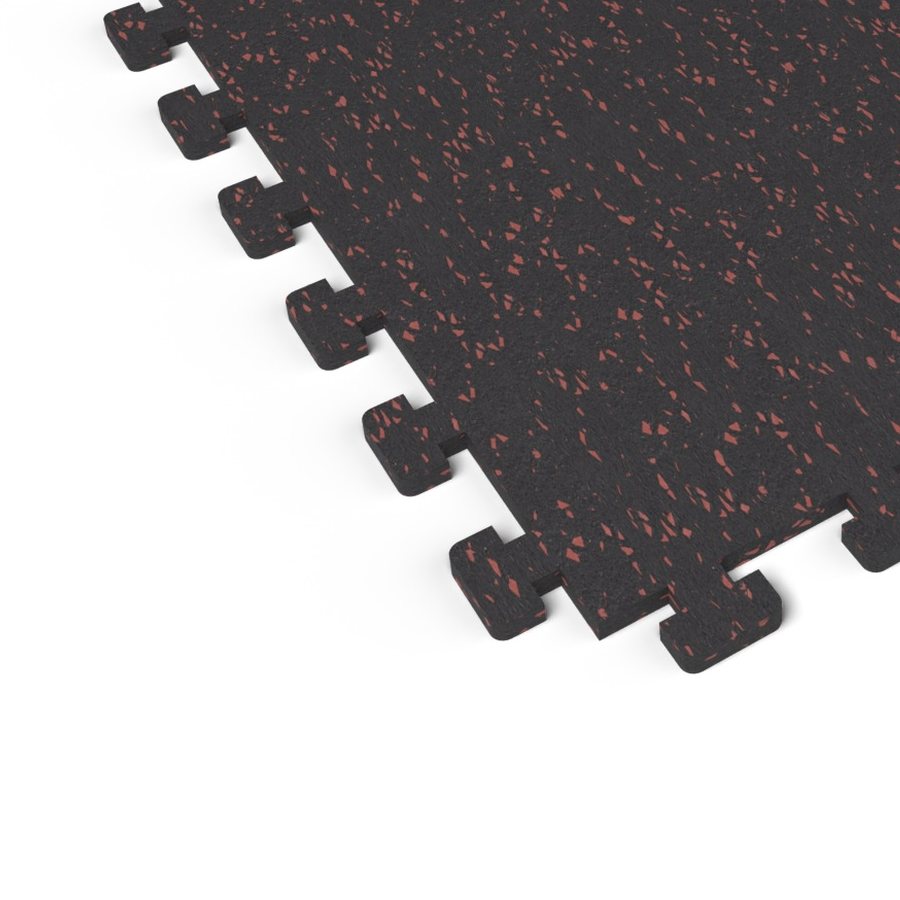 Close-up of the puzzle-edge interlock on a Firestorm Red REGUPOL aktivlok rubber gym tile showing red flecks on a black base
