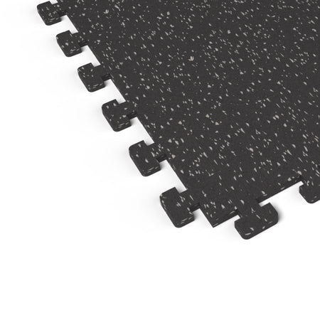 Close-up of the puzzle-edge interlock on a Gray Hound REGUPOL aktivlok rubber gym tile showing gray flecks on a black base