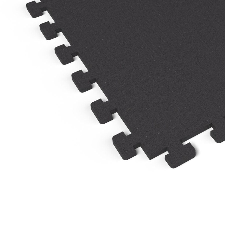 Close-up of the puzzle-edge interlock on a Jet Black REGUPOL aktivlok rubber gym tile showing a solid black surface