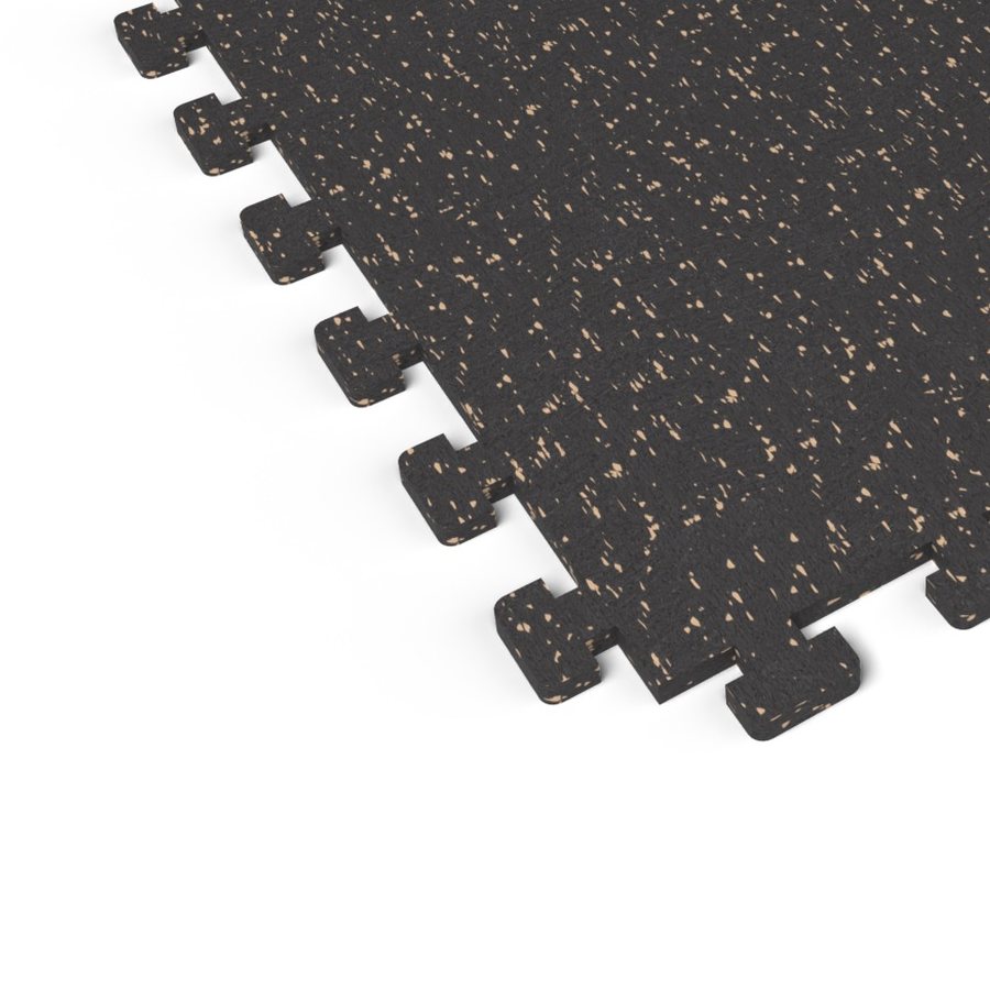 Close-up of the puzzle-edge interlock on a Titan Tan REGUPOL aktivlok rubber gym tile showing tan flecks on a black base