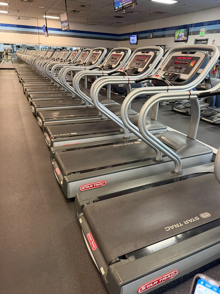 Row of Star Trac E-TRx commercial treadmills – used commercial gym equipment package
