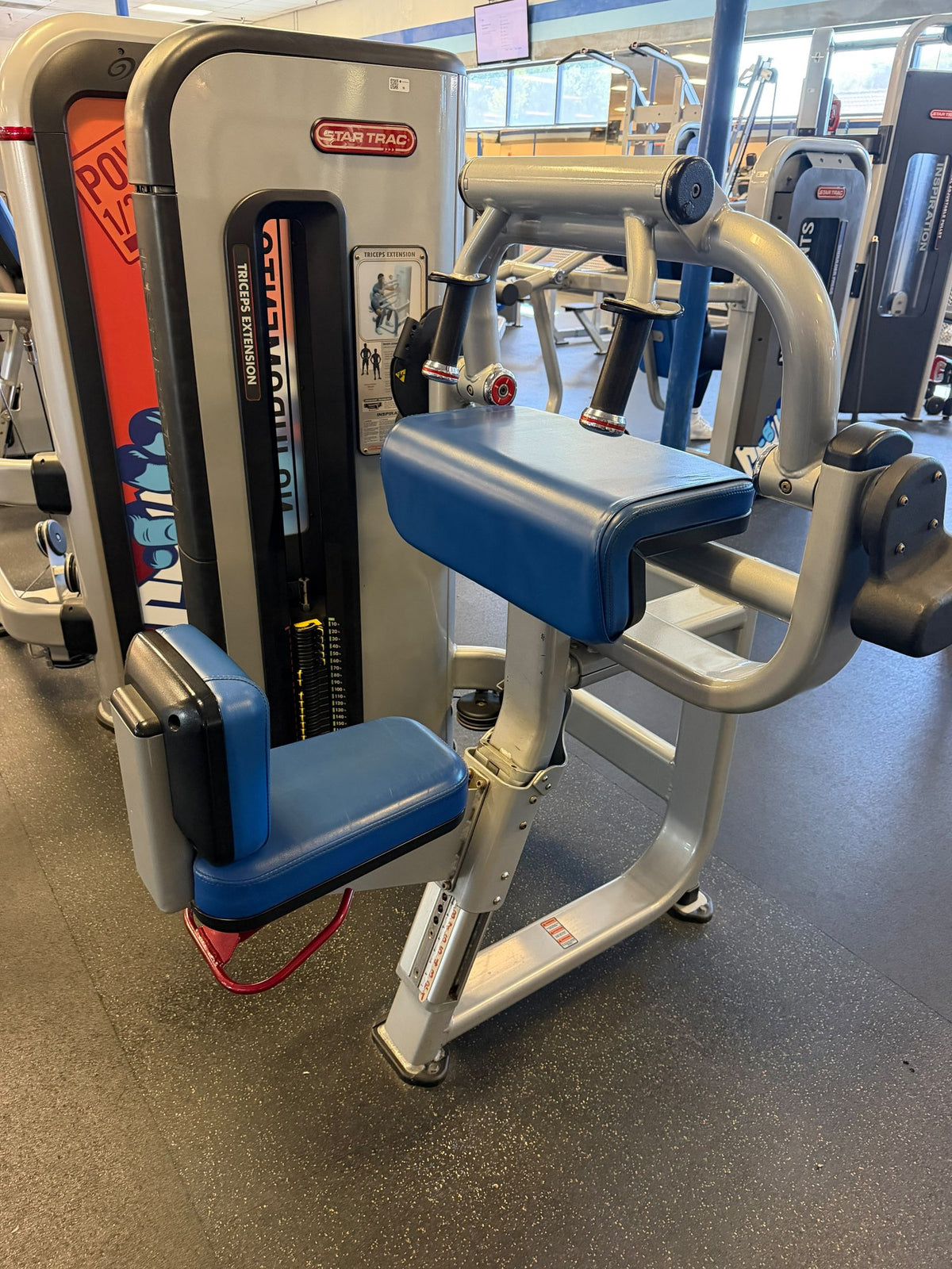 Star Trac selectorized arm machine – used commercial gym equipment package