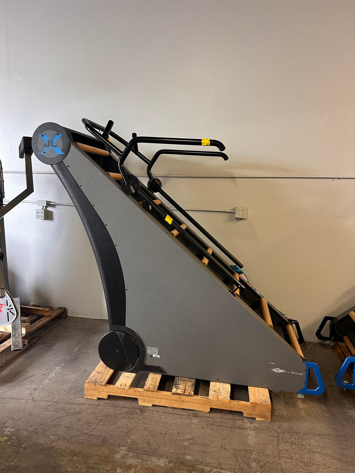 Used Jacob's Ladder commercial climbing cardio machine with wooden rungs and gray side panels – Global Gym Brokers